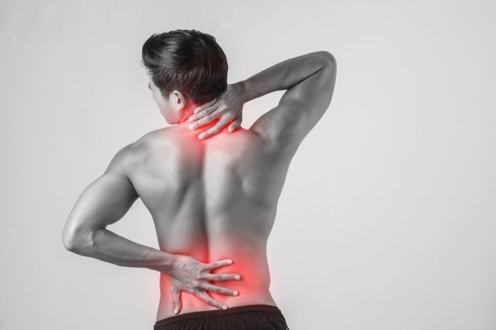 Interventional pain specialist assessing a patient with low back pain in Delhi