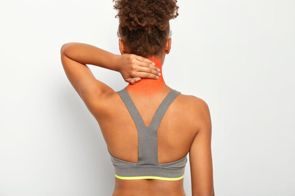 Interventional pain specialist assessing a patient with neck pain in Delhi