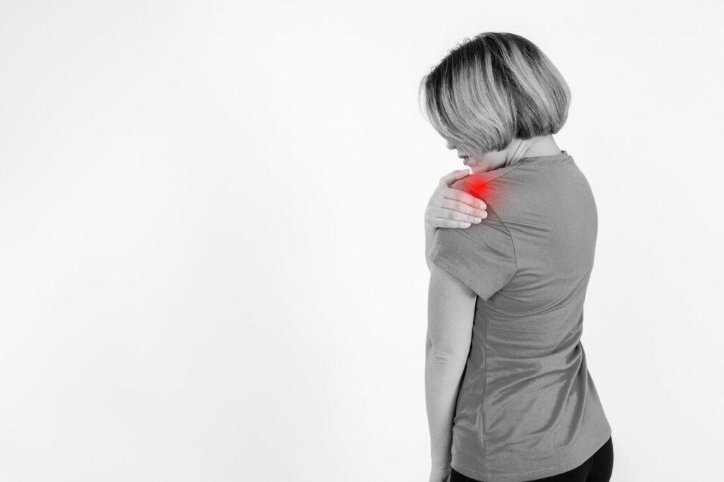 Interventional pain specialist assessing a patient with shoulder pain in Delhi